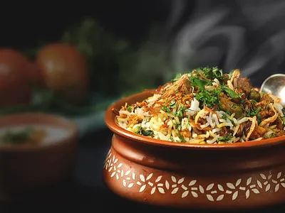 Weekend special thali with steamed rice, chana dal, paneer bhurji, and fresh salad